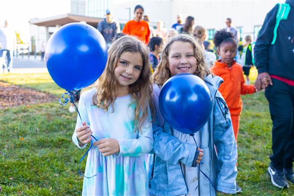 Students walking to school for National Walk to School Day.